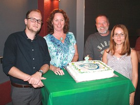 Green Drinks Sarnia, a monthly social gathering and informal discussion of environmental issues, marks its third birthday Sept. 14. Celebrating its second anniversary in 2015, in this file photo, are, from left, Cole Nadalin, Mary Jean O'Donnell, Dave Watson and Monica Shepley.   
File photo/Postmedia