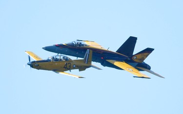 The Canadian Forces CF-18 Hornet and the CT-156 Harvard II performs at the 67th annual Canadian International Air Show (CIAS) soared over Lake Ontario and the CNE on the Labour Day weekend.  Sunday September 4, 2016. Jack Boland/Toronto Sun/Postmedia Network
