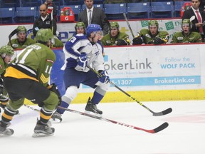 Sudbury Wolves veteran defenceman Kyle Capobianco avoids a pair of North Bay Battalion defenders during OHL exhibition action at Sudbury Community Arena on Sunday afternoon. Bruce Heidman/The Sudbury Star