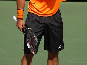 Marcos Baghdatis reacts after a point against Gael Monfils during the fourth round of the U.S. Open in New York on Sunday, Sept. 4, 2016. (Andres Kudacki/AP Photo)