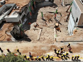 Israeli medics and emergency units work at a construction site where an underground car park collapsed on September 5, 2016 in the Ramat Hahayal neighbourhood in the coastal city of Tel Aviv. (GIL COHEN-MAGENGIL COHEN-MAGEN/AFP/Getty Images)