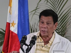 Philippine President Rodrigo Duterte speaks during a press conference at the airport in Davao City, in southern island of Mindanao  prior to his departure for Laos to attend the Asean summit on September 5, 2016. (MANMAN DEJETOMANMAN DEJETO/AFP/Getty Images)