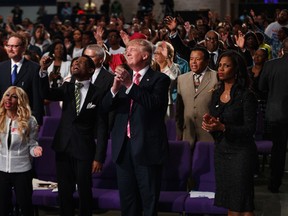Republican presidential candidate Donald Trump shown during a church service at Great Faith Ministries, Saturday, Sept. 3, 2016, in Detroit. (AP Photo/Evan Vucci)