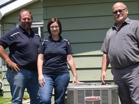 Randy Vince of Tillsonburg (right) was the recipient of a Lennox air conditioner during Prouse Electric and Mechanical's 2015 Random Act of Kindness. Nominations are open now for the 2016. R.A.K. - a new Lennox furnace. (CHRIS ABBOTT/FILE PHOTO)