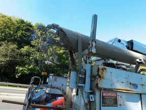 A wrecked light standard sits atop a hydro truck after a 28-year-old passenger of a Mazda 6 died in an early morning crash on Mount Pleasant northbound at Roxborough Dr. Monday, September 5, 2016. (Jack Boland/Toronto Sun)