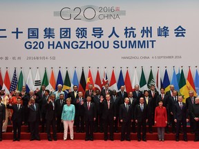 (Front row L-R) Brazil's President Michel Temer, Indonesia's President Joko Widodo, Mexico's President Enrique Pena Nieto, South Africa's President Jacob Zuma, US President Barack Obama, German Chancellor Angela Merkel, China's President Xi Jinping, Turkey's President Recep Tayyip Erdogan, Russia's President Vladimir Putin, French President Francois Hollande, South Korea's President Park Geun-Hye, Argentina's President Mauricio Macri, India's Prime Minister Narendra Modi; (2nd Row L-R) Saudi Arabia's Deputy Crown Prince and Minister of Defense Muhammad bin Salman Al Saud, Britain's Prime Minister Theresa May, Australia's Prime Minister Malcolm Turnbull, Italy's Prime Minister Matteo Renzi, Laos' President Bounnhang Vorachith, Kazakhstan's President Nursultan Nazarbayev, Chad's President Idriss Deby, Senegal's President Macky Sall, Egypt's President Abdel Fattah al-Sisi, Japan's Prime Minister Shinzo Abe, Canadian Prime Minister Justin Trudeau, European Council President Donald Tusk, President of the European Commission Jean-Claude Juncker; (3rd row L-R) Argentina's President Mauricio Macri, (unknown), IMF Managing Director Christine Lagarde, Thailand's Prime Minister Prayut Chan-O-Cha, Singapore's Prime Minister Lee Hsien Loong, Spain's Prime Minister Mariano Rajoy, UN Secretary-General Ban Ki-Moon, and three others pose for family photo in Hangzhou on Sept. 4, 2016. (GREG BAKER/AFP/Getty Images)