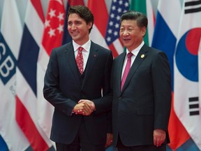 Canadian Prime Minister Justin Trudeau is greeted by Chinese President Xi Jinping during the official welcome at the G20 Leaders Summit in Hangzhou, Sunday, September 4, 2016. (THE CANADIAN PRESS/Adrian Wyld)