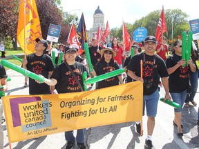 Labour supporters march through downtown Winnipeg, Man. Monday Sept. 5, 2016 in the annual Labour Day Parade put on by the Winnipeg Labour Council. (Brian Donogh/Winnipeg Sun/Postmedia Network)