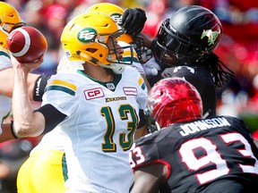 Eskimos quarterback Mike Reilly is taken down during Monday's game against the Stampeders in Calgary. (Al Charest)