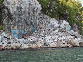 A long-time visitor to Killarney Provincial Park is furious someone defaced rocks with spray paint at the northwest corner of George Lake between two paddle-in campsites. Michael Stephenson is calling on Friends of Killarney Park to issue a reward to try to identify the culprits.