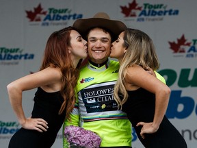 Philadelphia's Robin Carpenter celebrates his Tour of Alberta victory on stage at Churchill Square in Edmonton Monday. (Codie McLachlan)