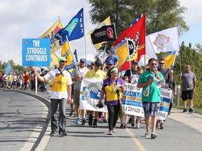 Participants take part in the The Sudbury and District Labour Council's  Labour Day Festival  march at Bell Park  in Sudbury, Ont. on Monday September 5, 2016. The event included activities and entertainment for the whole family. Gino Donato/Sudbury Star/Postmedia Network