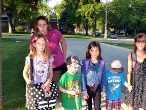 On their first day back to school at Upper Thames Elementary School (UTES) Sept. 6, Crystal McKay (back) walked Brianna Corriero, Dominic Tallon, Cali Pettipas, Anthony Tallon and Angelina Pettipas right up to the front doors of the school to ensure they got a good start to the new school year. GALEN SIMMONS MITCHELL ADVOCATE