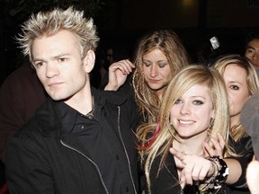 In this file photo, Avril Lavigne and former husband Deryck Whibley leave Bar Deluxe in Los Angeles, California on April, 12, 2008. (WENN.COM file photo)