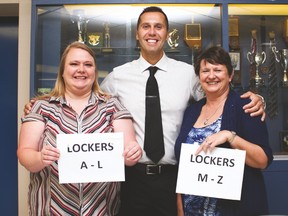 County Central High School teachers Christie Schneider and Janice Povey with principal Daniel Grimes in the middle, ready to give students direction on their first day of school.