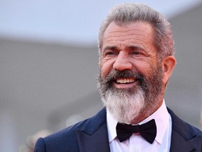 Director and actor Mel Gibson poses as he arrives on the red carpet for "Hacksaw Ridge" at the 73rd annual Venice International Film Festival, in Venice, Italy, Sunday, Sept. 4, 2016. (Ettore Ferrari/ANSA via AP)