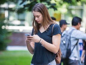 Four-time Olympic medallist Penny Oleksiak outside Monarch Park Collegiate in Toronto on Tuesday. (Ernest Doroszuk/Toronto Sun)