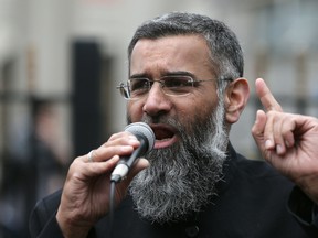 This is a Friday, April 3, 2015 file photo of Anjem Choudary, a British Muslim social and political activist and spokesman for Islamist group, Islam4UK, speaks following prayers at the Central London Mosque in Regent's Park, London. Choudary nne of Britain's best-known radical preachers Tuesday Sept. 6, 2016 was sentenced to 5 ½ years in prison for encouraging support for the Islamic State group. The 49-year-old Choudary has been one of the best-known faces of radical Islam in Britain for years. ﻿ (AP Photo/Tim Ireland, File)