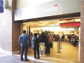 The unemployment line at the Service Canada desk in Edmonton. (Postmedia Network Photo)