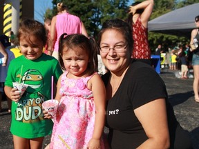 Four year-old Annabelle Paul, two year-old Lilianna Paul and mom Melody Mitchell enjoy a cool treat during the Sarnia Evangelical Missionary Church's annual SEMC Community Fair.
CARL HNATYSHYN/SARNIA THIS WEEK