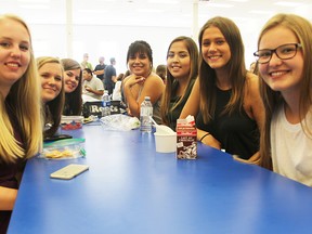 Grade 12 students at Great Lakes Secondary pose for a photo while having lunch on the first day of classes. From right to left are Kendyl Anderson, Alexa Eldridge, Mariah Henry, Sadie Redmond, Emma McCormick, Maggie Harper and Sydney Thompson.  (TYLER KULA, Sarnia Observer)