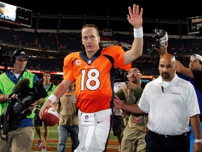 In this Sept. 5, 2013, file photo, Denver Broncos quarterback Peyton Manning (18) walks off the field after an NFL football game against the Baltimore Ravens, in Denver. (AP Photo/Joe Mahoney, File)