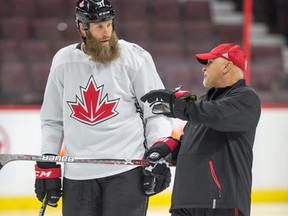 Team Canada's Joe Thornton with assistant coach Barry Trotz. (Wayne Cuddington, Postmedia Network)