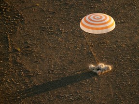 This photo provided by NASA shows the Soyuz TMA-20M spacecraft as it lands with Expedition 48 crew members NASA astronaut Jeff Williams, Russian cosmonauts Alexey Ovchinin, and Oleg Skripochka of Roscosmos near the town of Zhezkazgan, Kazakhstan, Wednesday, Sept. 7, 2016. A record-setting American and two Russians landed safely back on Earth Wednesday after a six-month mission aboard the International Space Station. (Bill Ingalls/NASA via AP)
