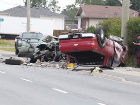 Const. Rick Carr of the Greater Sudbury Police Service traffic management unit takes notes at the scene of a serious motor vehicle collision on MR 80  in Sudbury, Ont. on Tuesday September 6, 2016. The highway was closed southbound at Valleyview Road and northbound at Donaldson Crescent. Gino Donato/Sudbury Star/Postmedia Network