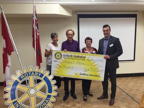 Rotary Club of Sudbury Sunrisers president Louise Bergeron, left, Sudbury Project Hope chair Jim Gordon, Sunriser Rotarian and Sudbury Project Hope member Barbara Roy and Rotary of Sudbury Sunrisers past president Beau Frescue take part in a donation for the Alramadan family. Supplied photo