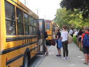 Students at Woodstock Collegiate Institute get ready to board school buses after the first day of school on Tuesday, Sept. 6, 2016. (MEGAN STACEY/Sentinel-Review)