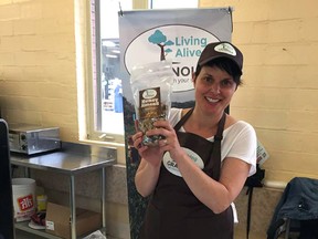 Stephanie Brown, co-owner of Living Alive Granola, displays a bag of their honey almond mix. Brown, along with former MP Joe Preston, launched the company in May and already have their products in about 20 stores around the region.