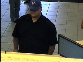 A bank robbery suspect is seen in surveillance footage from an Aug. 30 robbery in Richmond Hill.