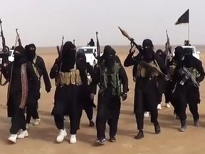 An image grab taken from a propaganda video uploaded on June 11, 2014 by jihadist group the Islamic State of Iraq and the Levant (ISIL) allegedly shows ISIL militants gathering at an undisclosed location in Iraq's Nineveh province. (AFP PHOTO / HO / ISIL-/AFP/Getty Images)