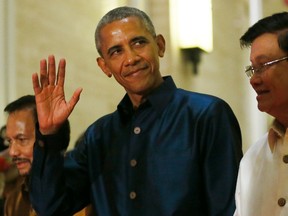 U.S. President Barack Obama waves to the media as he arrives for the gala dinner of ASEAN leaders and its Dialogue Partners in the ongoing 28th and 29th ASEAN Summits and other related summits at the National Convention Center Wednesday, Sept. 7, 2016 in Vientiane, Laos. (AP Photo/Bullit Marquez)