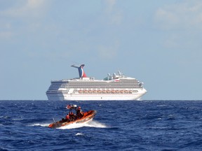 This U.S. Coast Guard photo obtained February 12, 2013 shows the Coast Guard Cutter Vigorous small boat as it patrols near the cruise ship Carnival Triumph in the Gulf of Mexico, February 11, 2013. (Jason Chambers/AFP/Getty Images)