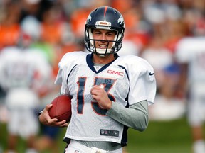 In this Aug. 4, 2016, file photo, Denver Broncos quarterback Trevor Siemian takes part in drills during the team’s training camp in Englewood, Colo. (AP Photo/David Zalubowski, File)