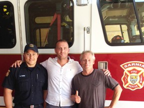 Sarnia firefighter Jim Rose is pictured with Sarnia man Matt Gordon, and Amherstburg man Mike Grimard. Grimard was rescued by Rose and Gordon after his boat capsized last Friday. (Submitted)
