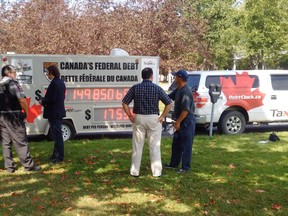 Laval University security expel organizers from the Debt Clock Campus Tour in this Wednesday Sept. 7, 2016 handout photo. The group was asked to leave because of unsanctioned activism. (Handout/Postmedia Network)