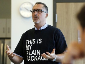 luke hendry/The Intelligencer
Health protection manager Roberto Almeida, wearing a shirt endorsing plain packaging for tobacco products, speaks to the Hastings and Prince Edward Counties Board of Health in Belleville Wednesday. The board endorsed plans for a federal law enforcing the use of such packaging.