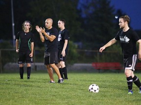 Head coach Giuseppe Politi Members of the Cambrian Golden Shield men's soccer team watches his players run through some drills during practice in Sudbury, Ont. on Tuesday September 6, 2016. Gino Donato/Sudbury Star/Postmedia Network