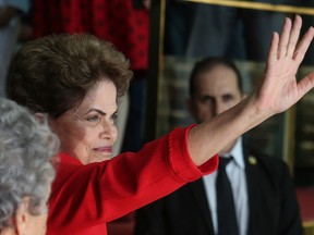 Impeached President Dilma Rousseff waves to the crowd before delivering her farewell address in Alvorado Palace on August 31, 2016 in Brasilia, Brazil. Rousseff was impeached by the Senate and is now permanently removed from office while being replaced by new President Michel Temer. (Photo by Mario Tama/Getty Images)