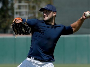 Tim Tebow throws a ball for baseball scouts and the media during a showcase on the campus of the University of Southern California in Los Angeles on Aug. 30, 2016. (Chris Carlson/AP Photo)