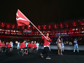 Canadian flag bearer David Eng leads the team into the stadium during the opening ceremony of the Rio 2016 Paralympic Games at Maracana Stadium on September 7, 2016 in Rio de Janeiro, Brazil. (Hagen Hopkins/Getty Images)