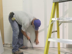 Municipal staff working on the renovation of the local museum’s gallery. (JONATHAN JUHA/STRATHROY AGE DISPATCH/POSTMEDIA NETWORK.)