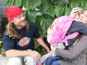 Robert Crossman and Roberta O'Brien comfort their daughter, Serenity, 4, at the first day of school at Princess Anne Public School in Sudbury, Ont. on Wednesday September 7, 2016. John Lappa/Sudbury Star/Postmedia Network