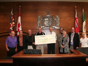 Submitted photo
Hastings County has received $102,409 in rebates from Union Gas under the Affordable Housing Conservation Program (AHCP). 
Shown here during the cheque presentation are Keith Reid, Quinte West councillor; Belleville councillor Garnet Thompson, chairman of community and human services committee; Douglas Bastedo, Union Gas; Peter Siemonsen, Union Gas; Rick Phillips, Warden; Steve Gatward, community and human services director; Pam Murphy, manager of housing services; Matt Carty, assistant manager­ facilities management; Igor Mozetic, Union Gas.