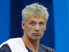 In this Aug. 9, 2016, file photo, United States' Ryan Lochte prepares before a men's 4x200-metre freestyle heat at the 2016 Summer Olympics, in Rio de Janeiro, Brazil. Lochte is banned from swimming through next June and will forfeit $100,000 in bonus money that went with his gold medal at the Olympics, part of the penalty for his drunken encounter at a gas station in Brazil during last month's games. (AP Photo/Michael Sohn, File)