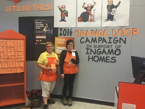 Chris Thomson (left) and Katie-Lee Leeder (right) show off the Woodstock Home Depot's Orange Door Campaign for 2016. All the money raised goes to Ingamo Homes to support programming for kids and teens. (Submitted)