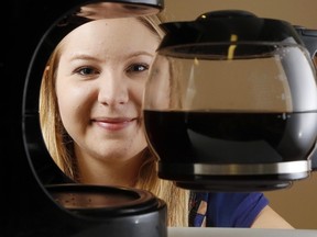 Amelia Huffman of the Alzheimer Society of Hastings-Prince Edward holds a fresh pot of coffee at the society's Bay View Mall headquarters in Belleville, Ont. Thursday, September 8, 2016. Staff and volunteers won't hold their annual doughnut sale this year and are instead expanding their Coffee Break program - a chance for the public to discuss dementia while raising funds to help patients and their families. 
Luke Hendry/Belleville Intelligencer/Postmedia Network